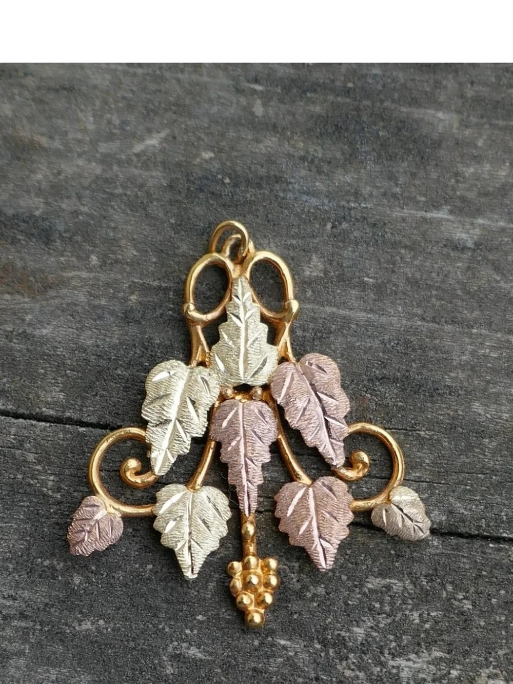 New old stock in original box. Vintage Black Hills Gold 10kt Large Grape Leaf &